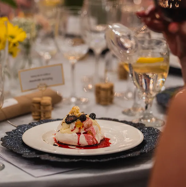 Berry pavlova dessert plated for a wedding reception